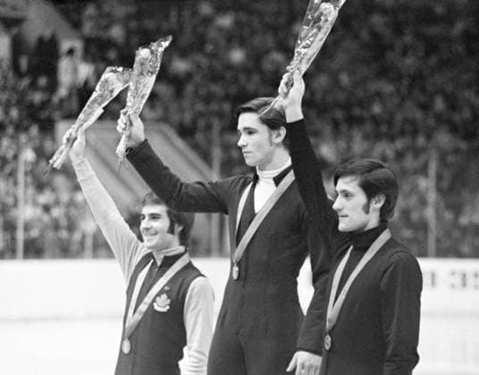 Moscow, USSR. Canadian athlete who won second place, Soviet athletes Vladimir Kovalyov took first place and Igor Bobrin won third place in men s single skating (L-R) stand on the podium during the awarding ceremony of the Figure skating, Eiskunstlauf medalists of the International Figure Skating Tournament Moscow Skates at the Palace of Sports of the Central Lenin Stadium. Konstantin Bulanov TASS  67242891