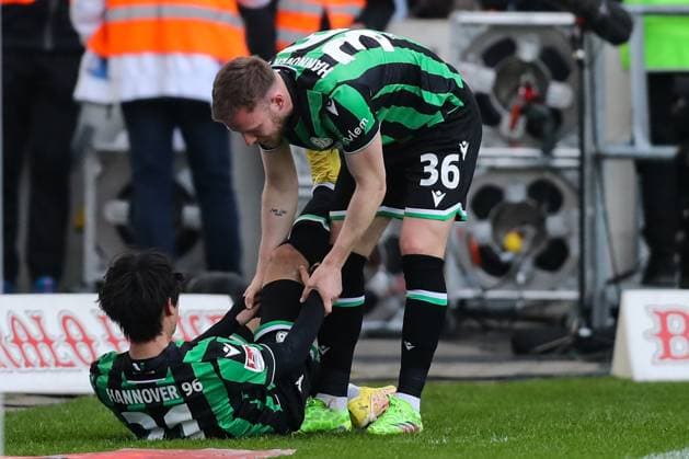 Goal celebration Goalscorer Sei Muroya Hannover 96,21 scores to 0 2 with Cedric Teuchert Hannover 96,36 2 Soccer Bundesliga Season 2023 2024 1 FC Magdeburg vs Hannover 96 at the MDCC Arena in Magdeburg Action,Soccer,Man,Men,Germany,31 03 2024