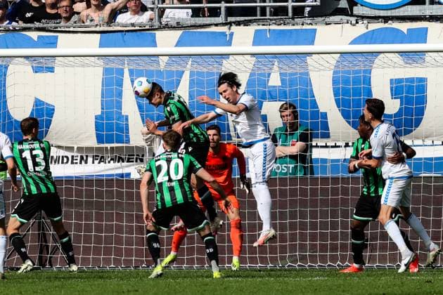 Nicolo Tresoldi Hannover 96,9 vs Jean Hugonet 1 FC Magdeburg,24 2 Soccer Bundesliga Season 2023 2024 1 FC Magdeburg vs Hannover 96 at the MDCC Arena in Magdeburg Action,Soccer,Man,Men,Germany,31 03 2024