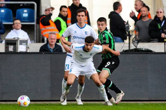 Nicolo Tresoldi Hannover 96,9 vs Daniel Elfadli 1 FC Magdeburg,6 and Tobias Müller 1 FC Magdeburg,21 2 Soccer Bundesliga Season 2023 2024 1 FC Magdeburg vs Hannover 96 at the MDCC Arena in Magdeburg Action,Soccer,Man,Men,Germany,31 03 2024