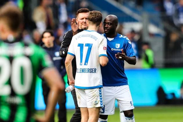 Coach Christian Titz with Alexander Nollenberger 1 FC Magdeburg,17 and Amara Conde 1 FC Magdeburg,29 2 Soccer Bundesliga Season 2023 2024 1 FC Magdeburg vs Hannover 96 at the MDCC Arena in Magdeburg Soccer,Man,Men,Germany,31 03 2024