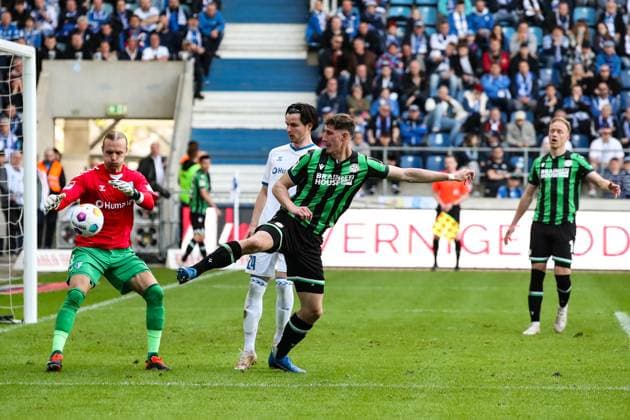 Phil Neumann Hannover 96,5 against Jean Hugonet 1 FC Magdeburg,24 and goalkeeper Dominik Reimann 1 FC Magdeburg,1 2 Soccer Bundesliga Season 2023 2024 1 FC Magdeburg vs Hannover 96 at the MDCC Arena in Magdeburg Action,Soccer,Man,Men,Germany,31 03 2024