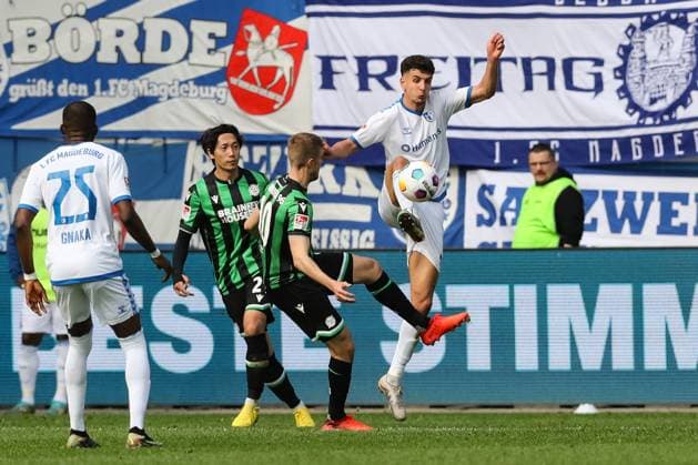 Daniel Elfadli 1 FC Magdeburg,6 vs Sebastian Ernst Hannover 96,10 2 Soccer Bundesliga Season 2023 2024 1 FC Magdeburg vs Hannover 96 at the MDCC Arena in Magdeburg Action,Soccer,Man,Men,Germany,31 03 2024