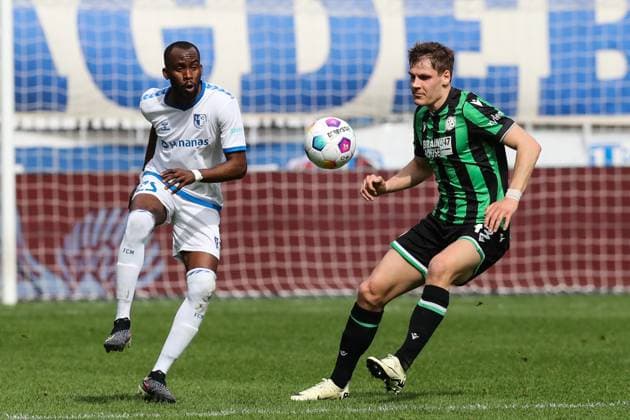 Max Christiansen Hannover 96,13 vs Silas Gnaka 1 FC Magdeburg,25 2 Soccer Bundesliga Season 2023 2024 1 FC Magdeburg vs Hannover 96 at the MDCC Arena in Magdeburg Action,Soccer,Man,Men,Germany,31 03 2024