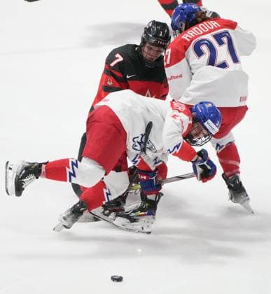 April 7, 2024, Utica, Ny, UNITED STATES: Canada s Laura Stacey (7) hooks Czechia s Adela Sapovalivova (3) during third period hockey action at the IIHF Women s World Hockey Championship in Utica, N.Y., Sunday, April 7, 2024. Canada News - April 7, 2024  - ZUMAc35_ 20240407_zaf_c35_038 Copyright: xChristinnexMuschix
