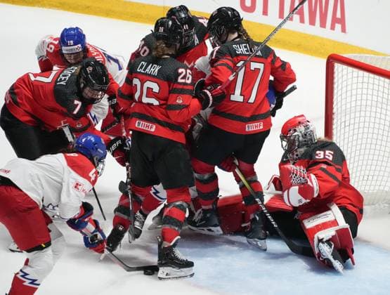 April 7, 2024, Utica, Ny, UNITED STATES: Czechia s Daniela Pejsova (4) digs for a rebound shot as Canada goaltender Ann-Renee Desbiens (35) drops in her net during third period hockey action at the IIHF Women s World Hockey Championship in Utica, N.Y., Sunday, April 7, 2024. Canada News - April 7, 2024  - ZUMAc35_ 20240407_zaf_c35_042 Copyright: xChristinnexMuschix