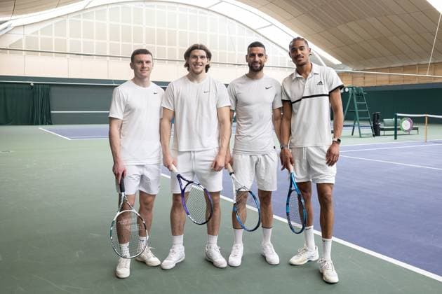 AFC Wimbledon Wimbledon Tennis Training Session AFC Wimbledon forward Josh Kelly (10), AFC Wimbledon forward Josh Davison (9), AFC Wimbledon forward Omar Bugiel (18), AFC Wimbledon forward Aron Sasu (29), during an AFC Wimbledon team visit to The All England Lawn Tennis and Croquet Club, Wimbledon, United Kingdom on 8 April 2024. Editorial use only , Copyright: xIanxStephenx PSI-19409-0007