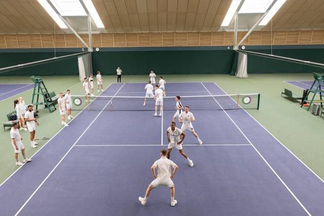 AFC Wimbledon Wimbledon Tennis Training Session AFC Wimbledon coaching staff and players warm up during an AFC Wimbledon team visit to The All England Lawn Tennis and Croquet Club, Wimbledon, United Kingdom on 8 April 2024. Editorial use only , Copyright: xIanxStephenx PSI-19409-0067