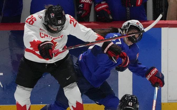 April 8, 2024, Utica, Ny, UNITED STATES: Canada s Emily Clark (26) and United States Abbey Murphy (37) battle at the boards during first period hockey action at the IIHF Women s World Hockey Championship in Utica, N.Y., Monday, April 8, 2024. Canada News - April 8, 2024  - ZUMAc35_ 20240408_zaf_c35_243 Copyright: xChristinnexMuschix