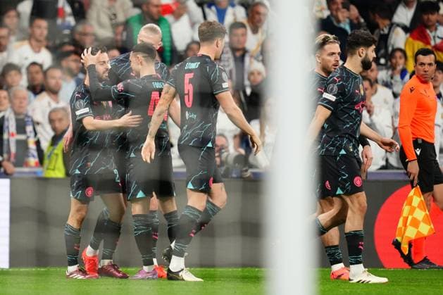 Bernardo Silva of Manchester City celebrates the 0-1 with his teammates Real Madrid and Manchester City. UEFA Champions League match. Quarter-finals, first leg. Football, Santiago Bernabeu Stadium, Madrid, Spain - 9 April 2024 Editorial use only  Copyright: xBaguxBlanco PRESSINPHOTO Shutterstockx 14427173c