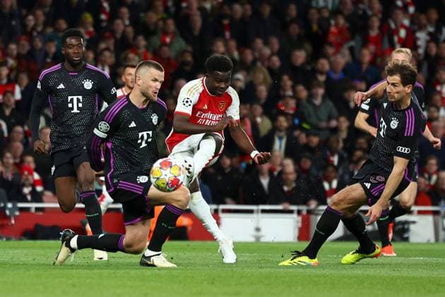 Bukayo Saka of Arsenal scores a goal for their side to make it 1-0 Arsenal v Bayern Munich, UEFA Champions League, Quarter Final, First Leg, Football, Emirates Stadium, London, UK - 09 Apr 2024 EDITORIAL USE ONLY No use with unauthorised audio, video, data, fixture lists, club league logos or live services. Online in-match use limited to 120 images, no video emulation. No use in betting, games or single club league player publications. Copyright: xSimonxDael Shutterstockx 14424047x