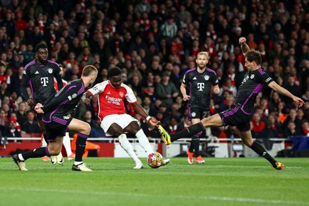 Bukayo Saka of Arsenal scores a goal for their side to make it 1-0 Arsenal v Bayern Munich, UEFA Champions League, Quarter Final, First Leg, Football, Emirates Stadium, London, UK - 09 Apr 2024 EDITORIAL USE ONLY No use with unauthorised audio, video, data, fixture lists, club league logos or live services. Online in-match use limited to 120 images, no video emulation. No use in betting, games or single club league player publications. Copyright: xSimonxDael Shutterstockx 14424047ab