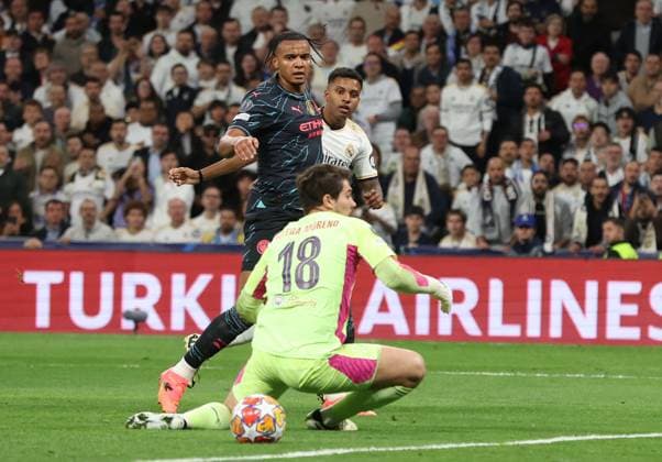 Madrid, Spain, 9th April 2024. Rodrygo of Real Madrid (R) scores their second goal during the UEFA Champions League match at the Santiago Bernabau, Madrid. Picture credit should read: Paul Terry Sportimage EDITORIAL USE ONLY. No use with unauthorised audio, video, data, fixture lists, club league logos or live services. Online in-match use limited to 120 images, no video emulation. No use in betting, games or single club league player publications. SPI-3066-0047