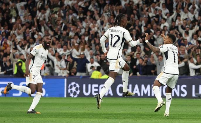 Madrid, Spain, 9th April 2024. Eduardo Camavinga of Real Madrid (C) celebrates after scoring the opening goal during the UEFA Champions League match at the Santiago Bernabau, Madrid. Picture credit should read: Paul Terry Sportimage EDITORIAL USE ONLY. No use with unauthorised audio, video, data, fixture lists, club league logos or live services. Online in-match use limited to 120 images, no video emulation. No use in betting, games or single club league player publications. SPI-3066-0050