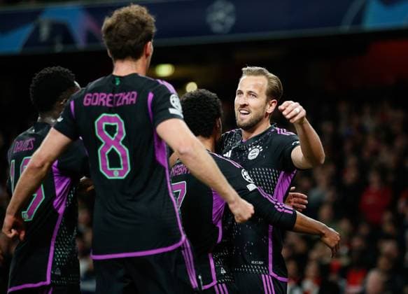 Harry Kane of Bayern Munich (right) celebrates with teammates after scoring his team s 2nd goal from the penalty spot Arsenal v Bayern Munich, UEFA Champions League 1 4 Final 1st Leg, Emirates Stadium, Highbury, London, UK - 09 04 2024 Editorial use only  Copyright: xMattxImpey Shutterstockx 14426976s