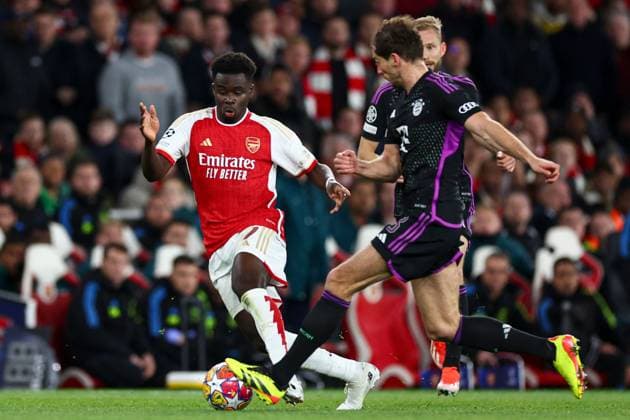 Bukayo Saka of Arsenal battles with Leon Goretzka of Bayern Munich Arsenal v Bayern Munich, UEFA Champions League, Quarter Final, First Leg, Football, Emirates Stadium, London, UK - 09 Apr 2024 EDITORIAL USE ONLY No use with unauthorised audio, video, data, fixture lists, club league logos or live services. Online in-match use limited to 120 images, no video emulation. No use in betting, games or single club league player publications. Copyright: xSimonxDael Shutterstockx 14424047be
