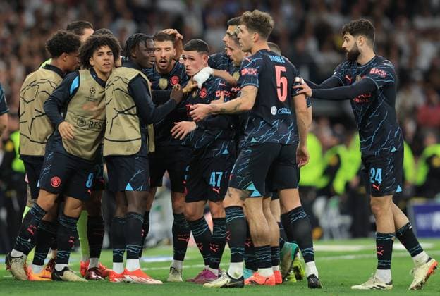 Madrid, Spain, 9th April 2024. Phil Foden of Manchester City (C) celebrates with team mates after scoring his teams second goal during the UEFA Champions League match at the Santiago Bernabau, Madrid. Picture credit should read: Paul Terry Sportimage EDITORIAL USE ONLY. No use with unauthorised audio, video, data, fixture lists, club league logos or live services. Online in-match use limited to 120 images, no video emulation. No use in betting, games or single club league player publications. SPI-3066-0070