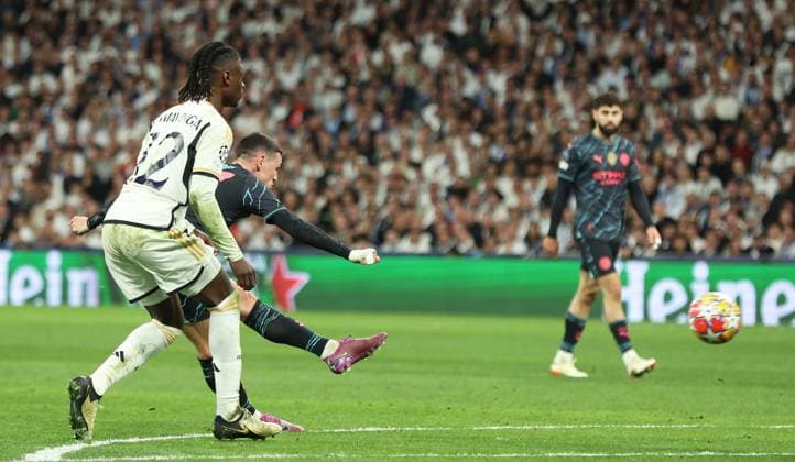 Madrid, Spain, 9th April 2024. Phil Foden of Manchester City (2L) scores his teams second goal during the UEFA Champions League match at the Santiago Bernabau, Madrid. Picture credit should read: Paul Terry Sportimage EDITORIAL USE ONLY. No use with unauthorised audio, video, data, fixture lists, club league logos or live services. Online in-match use limited to 120 images, no video emulation. No use in betting, games or single club league player publications. SPI-3066-0073