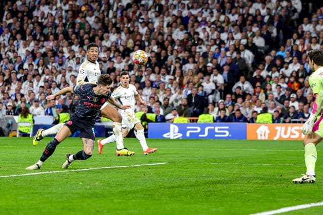 Real Madrid v Manchester City Champions League 09 04 2024. John Stones (5) of Manchester City heads clear during the Champions League match between Real Madrid and Manchester City at the Santiago Bernabeu Stadium, Madrid, Spain on 9 April 2024. Editorial use only , Copyright: xNigelxKeenex PSI-19414-0048