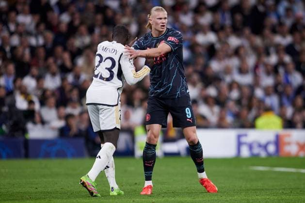 Ferland Mendy of Real Madrid CF and Erling Haaland of Manchester City FC Real Madrid v Manchester City, UEFA Champions League, Quarter Final, First Leg, Football, Santiago Bernabeu Stadium, Madrid, Spain - 09 Apr 2024 EDITORIAL USE ONLY No use with unauthorised audio, video, data, fixture lists, club league logos or live services. Online in-match use limited to 120 images, no video emulation. No use in betting, games or single club league player publications. Copyright: xRubenxAlbarran Shutterstockx 14425023dx