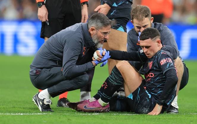 Madrid, Spain, 9th April 2024. Phil Foden of Manchester City (C) leaves the field injured during the UEFA Champions League match at the Santiago Bernabau, Madrid. Picture credit should read: Paul Terry Sportimage EDITORIAL USE ONLY. No use with unauthorised audio, video, data, fixture lists, club league logos or live services. Online in-match use limited to 120 images, no video emulation. No use in betting, games or single club league player publications. SPI-3066-0084