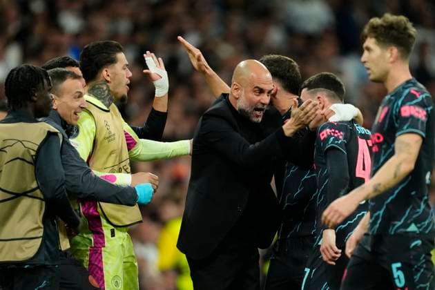 Real Madrid CF v Manchester City: Quarter-final First Leg - UEFA Champions League 2023 24 Phil Foden left winger of Manchester City and England celebrates with Pep Guardiola head coach of Manchester City after scoring his sides first goal during the UEFA Champions League quarter-final first leg match between Real Madrid CF and Manchester City at Estadio Santiago Bernabeu on April 9, 2024 in Madrid, Spain. Madrid Spain  Copyright: xJosexBretonx originalFilename:breton-realmadr240409_npTH0.jpg