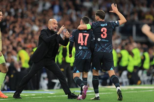 Madrid, Spain, 9th April 2024. Phil Foden of Manchester City celebrates with Pep Guardiola, Manager of Manchester City after scoring to make it 2-2 during the UEFA Champions League match at the Santiago Bernabau, Madrid. Picture credit should read: Paul Terry Sportimage EDITORIAL USE ONLY. No use with unauthorised audio, video, data, fixture lists, club league logos or live services. Online in-match use limited to 120 images, no video emulation. No use in betting, games or single club league player publications. SPI-3066-0093