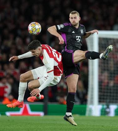 London, England, 9th April 2024. Kai Havertz of Arsenal (left) and Matthijs de Ligt of Bayern Munich (right) compete for the ball in the air during the UEFA Champions League match at the Emirates Stadium, London. Picture credit should read: Kieran Cleeves Sportimage EDITORIAL USE ONLY. No use with unauthorised audio, video, data, fixture lists, club league logos or live services. Online in-match use limited to 120 images, no video emulation. No use in betting, games or single club league player publications. SPI-3065-0069