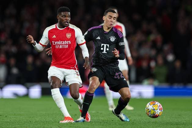 London, England, 9th April 2024. Thomas Partey of Arsenal (left) and Jamal Musiala of Bayern Munich (right) battle for the ball during the UEFA Champions League match at the Emirates Stadium, London. Picture credit should read: Kieran Cleeves Sportimage EDITORIAL USE ONLY. No use with unauthorised audio, video, data, fixture lists, club league logos or live services. Online in-match use limited to 120 images, no video emulation. No use in betting, games or single club league player publications. SPI-3065-0129