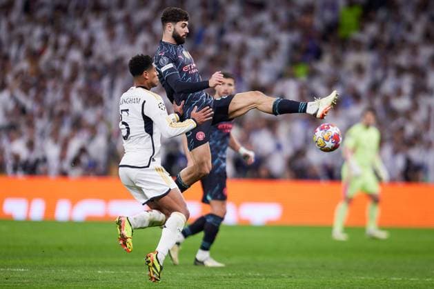 April 9, 2024, Madrid, Spain: (L-R) Jude Bellingham of Real Madrid CF and Josko Gvardiol of Manchester City FC seen in action during the UEFA Champions League quarterfinal first leg football match between Real Madrid CF and Manchester City FC at the Santiago Bernabeu Stadium. Final score; Real Madrid 3:3 Manchester City Madrid Spain - ZUMAs197 20240409_aaa_s197_277 Copyright: xRubenxAlbarranx