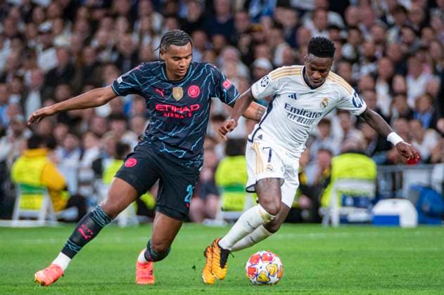 UEFA Champions League 2023 24 Quarter-final First Leg: Real Madrid CF v Manchester City Vinicius Junior of Real Madrid (R) in action against Manuel Akanji of Manchester City (L) during the UEFA Champions League quarter-final first leg match between Real Madrid CF and Manchester City at Estadio Santiago Bernabeu on April 9, 2024 in Madrid, Spain. Madrid Estadio Santiago Bernabeu Madrid Spain Copyright: xAlbertoxGardinx AGardin_20240409_football_Champions_League_Real_Madrid_vs_Manchester_City_078