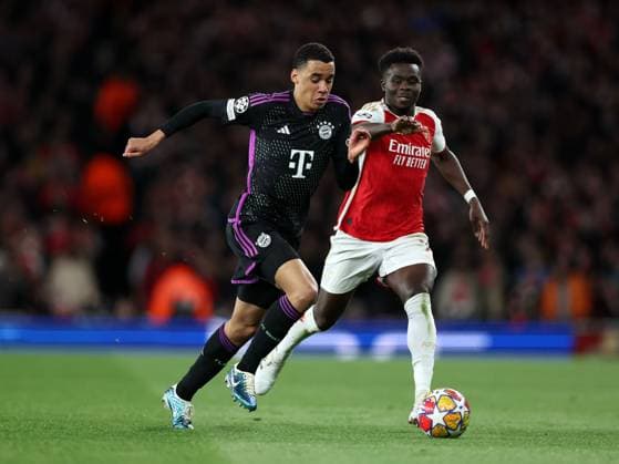 Jamal Musiala of Bayern Munich gets away from Bukayo Saka of Arsenal Arsenal v Bayern Munich, UEFA Champions League 1 4 Final 1st Leg, Emirates Stadium, Highbury, London, UK - 09 04 2024 Editorial use only  Copyright: xMattxImpey Shutterstockx 14426976bj