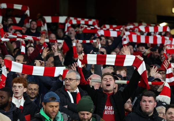 Arsenal fans hold aloft their scarves before the game Arsenal v Bayern Munich, UEFA Champions League 1 4 Final 1st Leg, Emirates Stadium, Highbury, London, UK - 09 04 2024 Editorial use only  Copyright: xMattxImpey Shutterstockx 14426976az