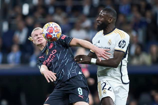 (240410) -- MADRID, April 10, 2024 -- Real Madrid s Antonio Rudiger (R) vies with Manchester City s Erling Haaland during the UEFA Champions League quarterfinal 1st Leg match between Real Madrid and Manchester City in Madrid, April 9, 2024. (Photo by Xinhua) (SP)SPAIN-MADRID-FOOTBALL-UEFA CHAMPIONS LEAGUE-REAL MADRID VS MANCHESTER CITY GustavoxValiente 