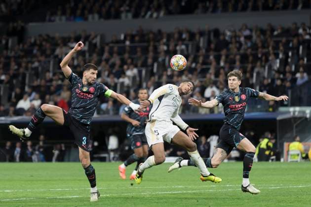 Real Madrid CF v Manchester City: Quarter-final First Leg - UEFA Champions League 2023 24 Ruben Dias of Manchester City and Jude Bellingham of Real Madrid are fighting for the ball during the UEFA Champions League 2023 24 round of 8 first leg match between Real Madrid and Manchester City at Santiago Bernabeu Stadium in Madrid, Spain, on April 9, 2023. Madrid Spain  Copyright: xGuillermoxMartinezx originalFilename:martinez-uefacham240409_npA5n.jpg