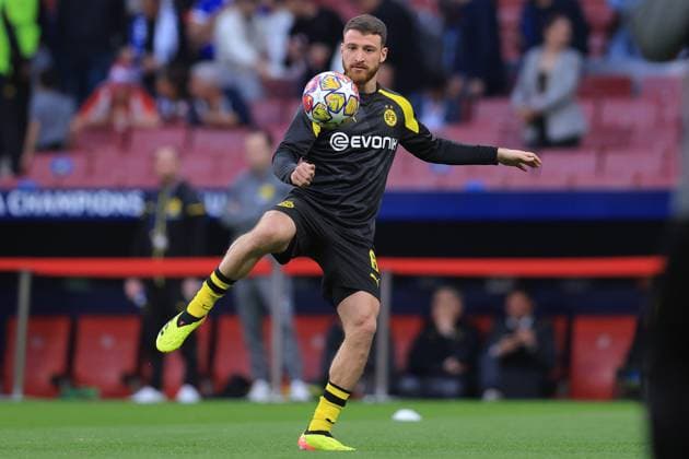Madrid, Spain, 10th April 2024. Salih Ozcan of Borussia Dortmund warms up before the UEFA Champions League match at Wanda Metropolitano, Madrid. Picture credit should read: Paul Terry Sportimage EDITORIAL USE ONLY. No use with unauthorised audio, video, data, fixture lists, club league logos or live services. Online in-match use limited to 120 images, no video emulation. No use in betting, games or single club league player publications. SPI-3067-0010