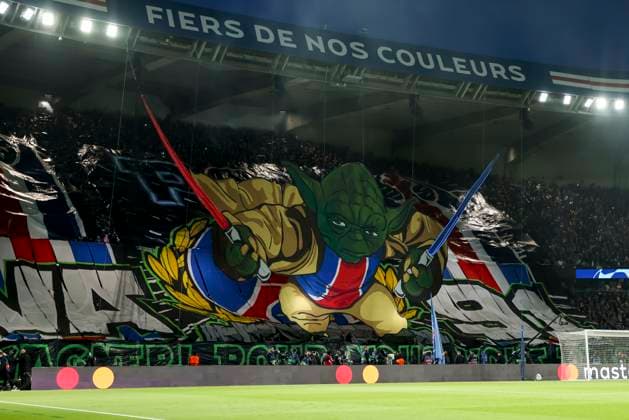 PSG supporters unvail a giantbanner with a depiction of the Star Wars character Yoda wearing ashirt in the stand, UEFA Champions League 2023 24 - Quarter-final First Leg, Paris Saint-Germain vs FC Barcelona, Barca Parc des Princes, April 10, 2024, Paris, France.