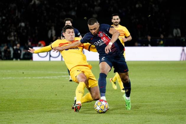 Kylian Mbappe of PSG is tackled by Andreas Christensen of Barcelona Paris Saint-Germain v Barcelona, UEFA Champions League, Quarter Final, First Leg, Football, Parc des Princes, Paris, France - 10 Apr 2024 EDITORIAL USE ONLY No use with unauthorised audio, video, data, fixture lists, club league logos or live services. Online in-match use limited to 120 images, no video emulation. No use in betting, games or single club league player publications. Copyright: xDavexWinter Shutterstockx 14424874co