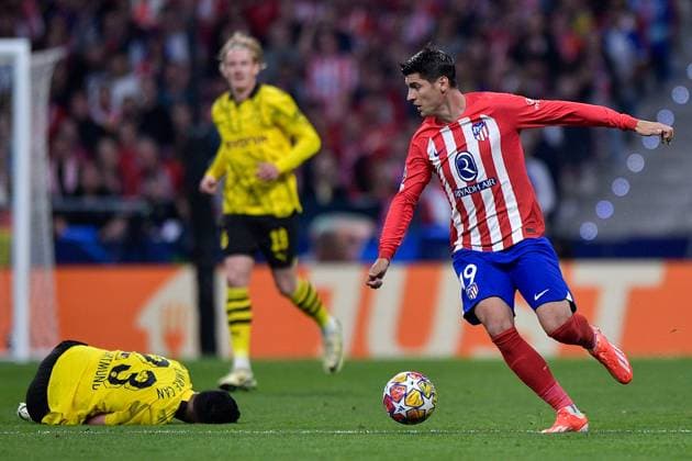 2024-04-10 Atletico Madrid v Borussia Dortmund - Quarter-final First Leg - UEFA Champions League 2023 24 MADRID, SPAIN - APRIL 10: Emre Can of Borussia Dortmund battles for the ball with Alvaro Morata of Atletico Madrid during the Quarter-final First Leg - UEFA Champions League 2023 24 match between Atletico Madrid and Borussia Dortmund at Civitas Metropolitano Stadium on April 10, 2024 in Madrid, Spain. (Photo by Pablo Morano BSR Agency) Madrid Spain Content not available for redistribution in The Netherlands directly or indirectly through any third parties. Copyright: xBSRxAgencyx