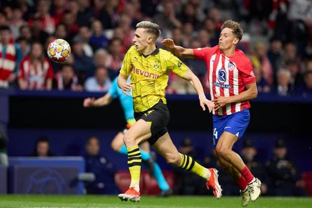 Marcos Llorente of Atletico de Madrid battles for the ball with Nico Schlotterbeck of Borussia Dortmund during the UEFA Champions League 2023 24 quarter-finals match between Atletico de Madrid and Borussia Dortmund at Stadium Civitas Metropolitano on April 10, 2024 in Madrid, Spain. FOOTBALL : Atletico Madrid vs Borussia Dormund - UEFA Ligue des Champions - 1 4 Quart - 10 04 2024 LGM Panoramic 