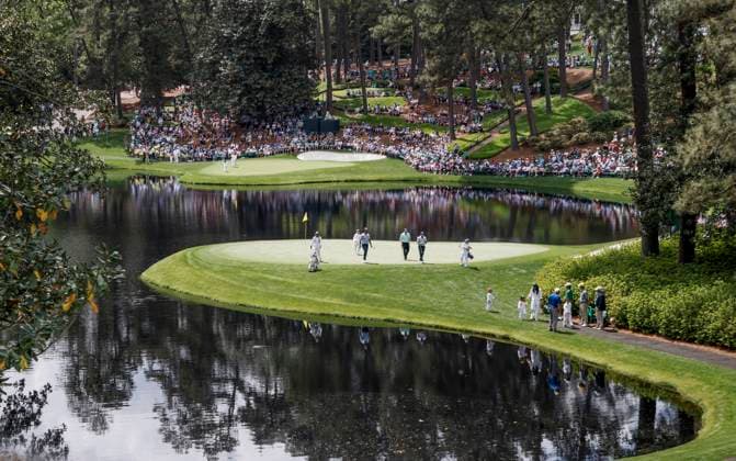 Golfers walk off the eighth green during the Par 3 contest at the Masters Tournament at Augusta National Golf Club in Augusta, Georgia on Wednesday, April 10, 2024.  AUG20240410549 TANNENxMAURY