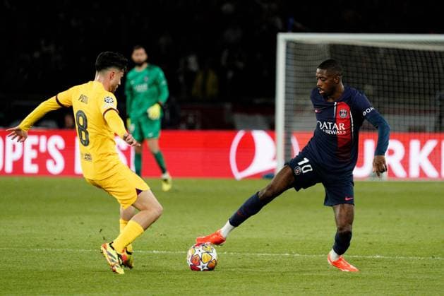 Ousmane Dembele of PSG takes on Pedri of Barcelona Paris Saint-Germain v Barcelona, UEFA Champions League, Quarter Final, First Leg, Football, Parc des Princes, Paris, France - 10 Apr 2024 EDITORIAL USE ONLY No use with unauthorised audio, video, data, fixture lists, club league logos or live services. Online in-match use limited to 120 images, no video emulation. No use in betting, games or single club league player publications. Copyright: xDavexWinter Shutterstockx 14424874in