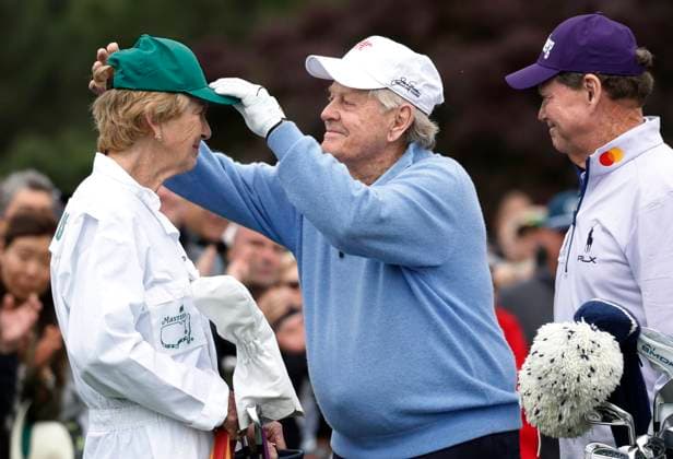 Honorary starter Jack Nicklaus places a green caddies cap on his wife Barbara as Tom Watson watches before teeing off on the first hole before the first round of the Masters Tournament at Augusta National Golf Club in Augusta, Georgia on Thursday, April 11, 2024.  AUG20240411106 JOHNxANGELILLO