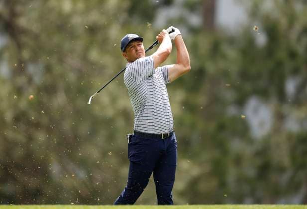 Bryson DeChambeau hits his tee shot on the fourth hole during the first round of the Masters Tournament at Augusta National Golf Club in Augusta, Georgia on Thursday, April 11, 2024.  AUG20240411115 JOHNxANGELILLO