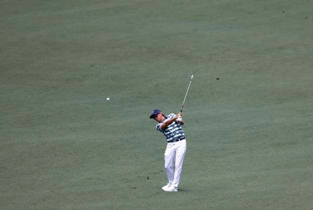 Rickie Fowler hits to the green on the second hole during the first round of the Masters Tournament at Augusta National Golf Club in Augusta, Georgia on Thursday, April 11, 2024.  AUG20240411540 TANNENxMAURY