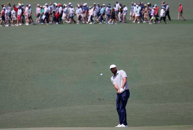 Scottie Scheffler hits an approach shot to the green on the second hole during the first round of the Masters Tournament at Augusta National Golf Club in Augusta, Georgia on Thursday, April 11, 2024.  AUG20240411562 TANNENxMAURY