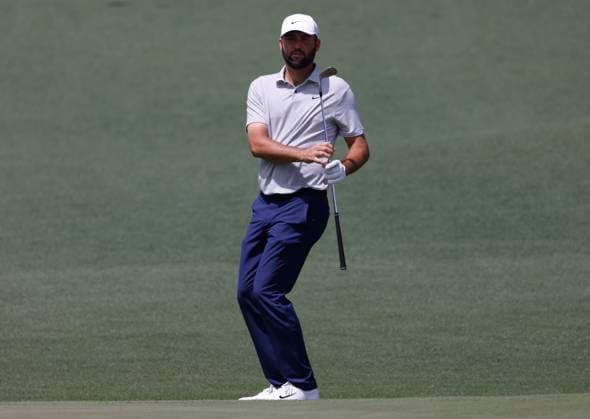 Scottie Scheffler watches his an approach shot on the second hole during the first round of the Masters Tournament at Augusta National Golf Club in Augusta, Georgia on Thursday, April 11, 2024.  AUG20240411564 TANNENxMAURY