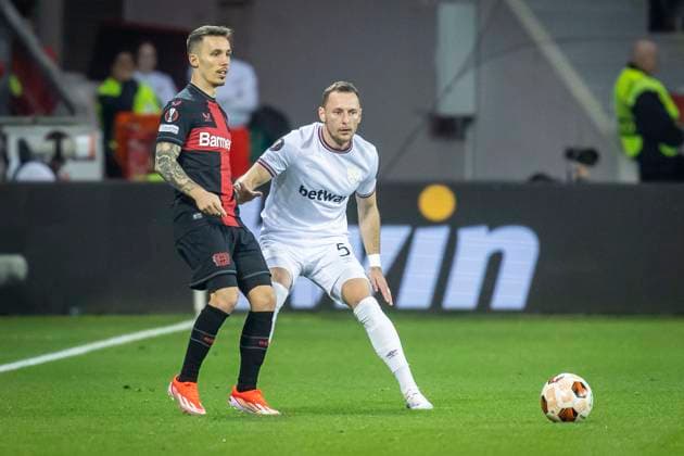 UEFA Europa League, Bayer 04 Leverkusen vs West Ham United, 11 04 2024 Leverkusen, Germany April 11 Alejandro Grimaldo Bayer 04 Leverkusen, 20 , Vladimir Coufal West Ham United, 5 during the UEFA Europa Leeague quarter finals between UEFA Europa League, Bayer 04 Leverkusen vs West Ham United at BayArena on April 11, 2024 in Leverkusen, Germany DFL REGULATIONS PROHIBIT ANY USE OF PHOTOGRAPHS AS IMAGE SEQUENCES AND OR QUASI VIDEO Copyright: xBEAUTIFULxSPORTS AxelxKohringx