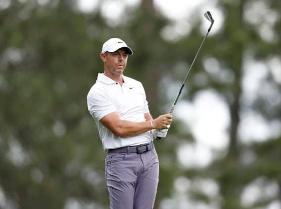 Northern Ireland s Rory McIlroy watches his tee shot on the fourth hole during the first round of the Masters Tournament at Augusta National Golf Club in Augusta, Georgia on Thursday, April 11, 2024.  AUG20240411127 JOHNxANGELILLO