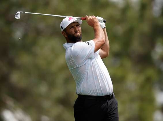 Spain s Jon Rahm hits his tee shot on the fourth hole during the first round of the Masters Tournament at Augusta National Golf Club in Augusta, Georgia on Thursday, April 11, 2024.  AUG20240411130 JOHNxANGELILLO